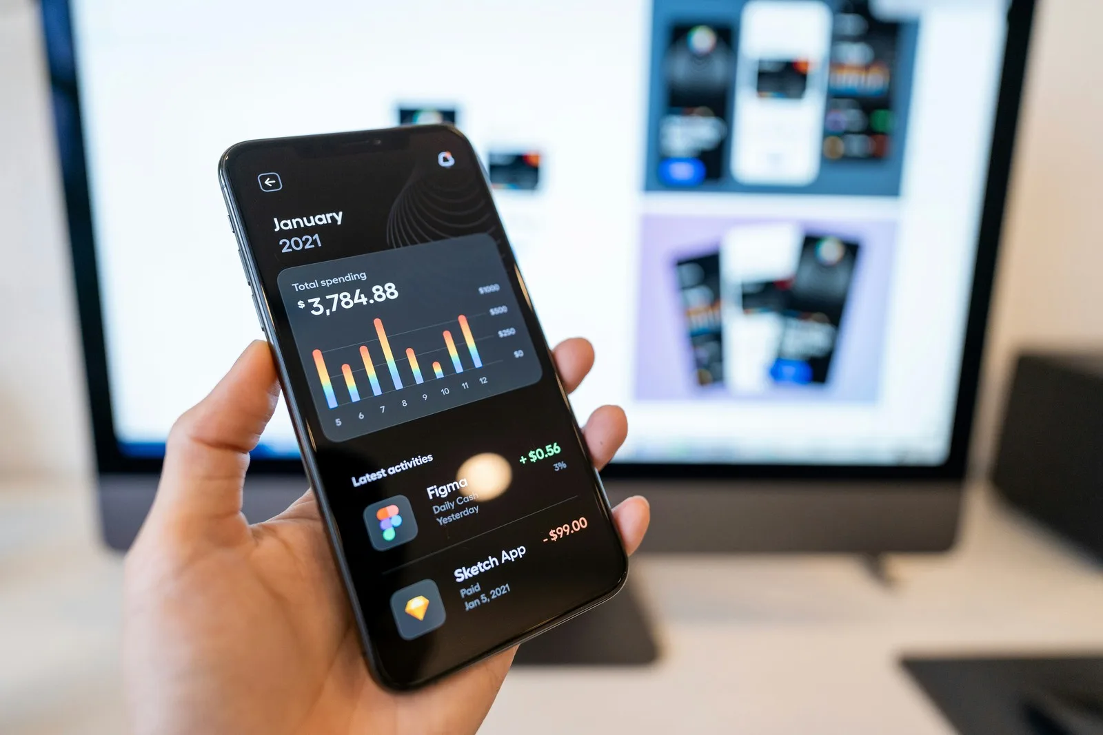 Developer working at a dark-mode coding environment on a desktop monitor for native iOS Swift app development