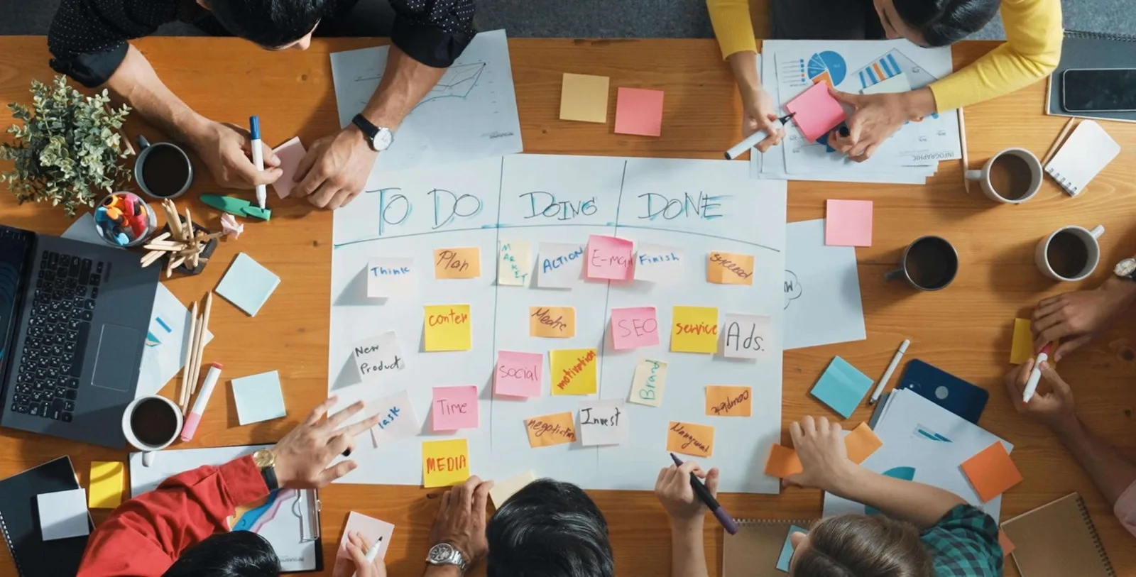 Agile sprint planning board with colorful sticky notes representing mobile app development workflow differences between startups and enterprise clients